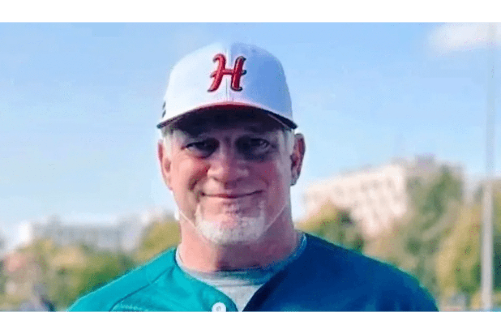 A man in a baseball uniform and hat.